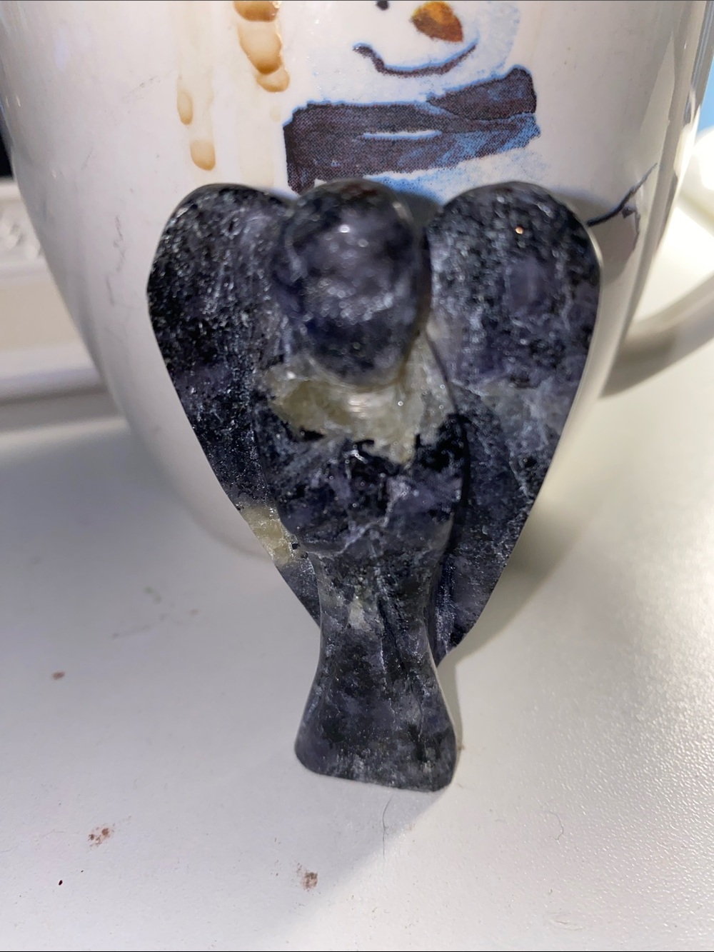 hand-carved guardian angel figurine made from Larvikite